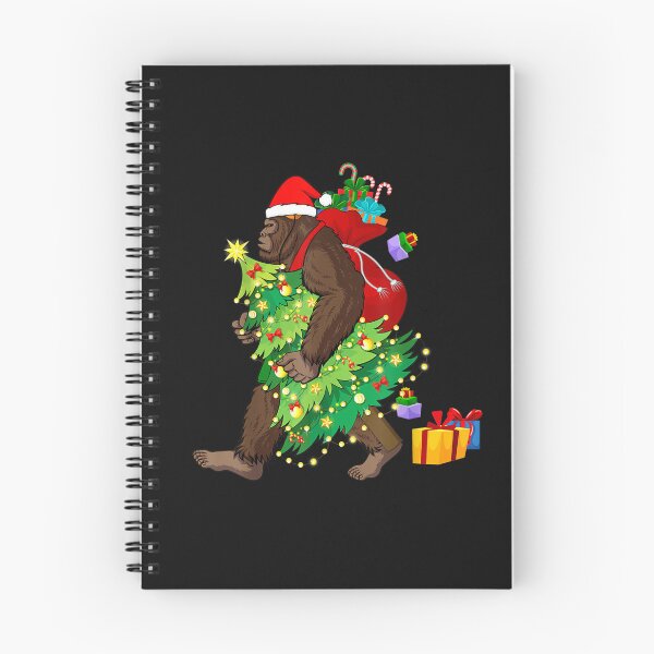Item preview, Bigfoot Squatching Through the Snow Christmas Tree Sasquatch T-Shirt designed and sold by Blue-Rechard.