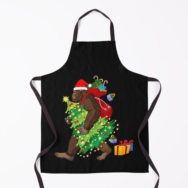 Item preview, Bigfoot Squatching Through the Snow Christmas Tree Sasquatch T-Shirt designed and sold by Blue-Rechard.