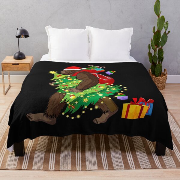 Item preview, Bigfoot Squatching Through the Snow Christmas Tree Sasquatch T-Shirt designed and sold by Blue-Rechard.