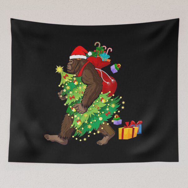 Item preview, Bigfoot Squatching Through the Snow Christmas Tree Sasquatch T-Shirt designed and sold by Blue-Rechard.