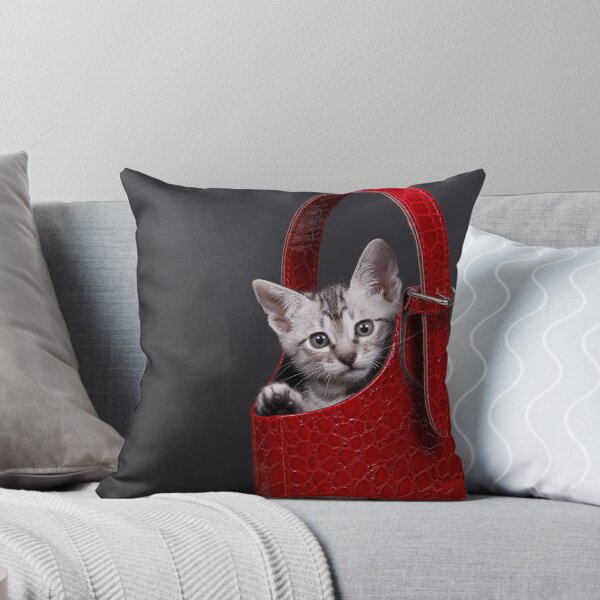 Item preview, Gatito gris y blanco dentro de un monedero rojo designed and sold by Spring Reilly.