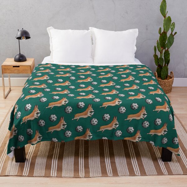 Corgi with bouncing Pickleballs on a deep emerald green background Throw Blanket
