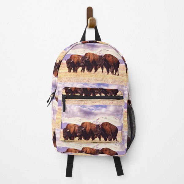 Item preview, Three Bison are Grazing in a Field in Colorado, Surrounded by Mountains Covered in Snow designed and sold by Rocky Mountain Artistry.