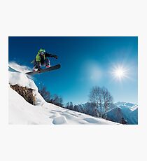 Snowboarder Jumping on a snowy mountain Photographic Print