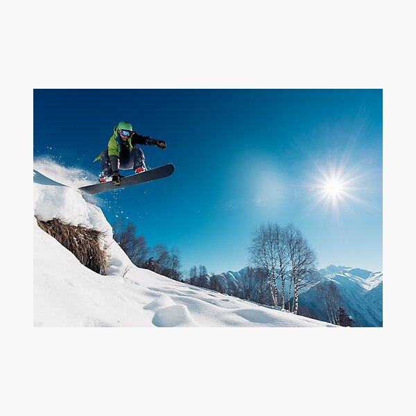 Snowboarder Jumping on a snowy mountain Photographic Print