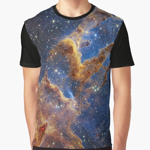 The Pillars of Creation are set off in a kaleidoscope of color in NASA’s James Webb Space Telescope’s near-infrared-light view. The pillars look like arches and spires rising out of a desert landscape Graphic T-Shirt