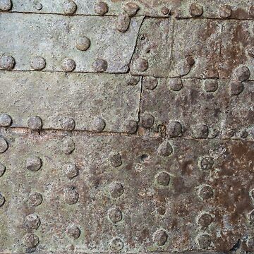 Rusty metal texture. Studded iron plate. Rivets on old rusty metal