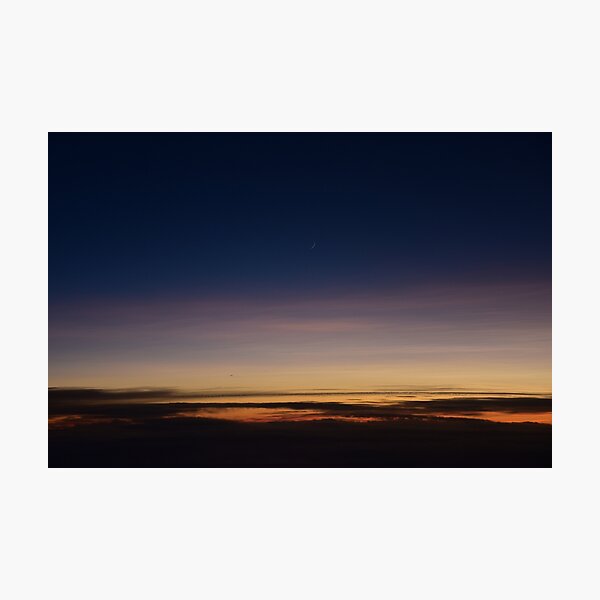 Moon rising above the clouds; sunset above clouds; sunset; moon Photographic Print