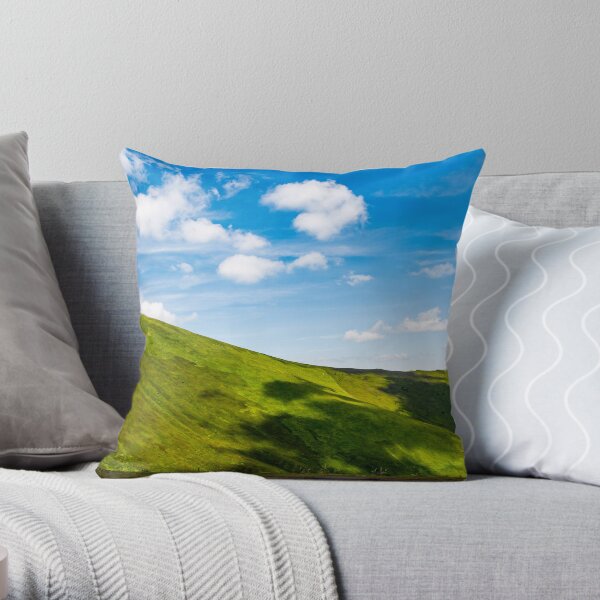 green alps under blue sky Throw Pillow
