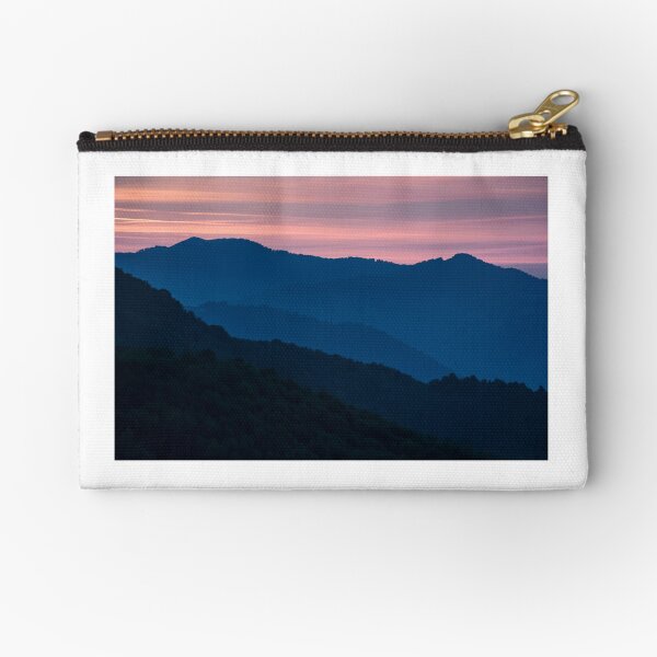 reddish sky at dawn in mountains Zipper Pouch