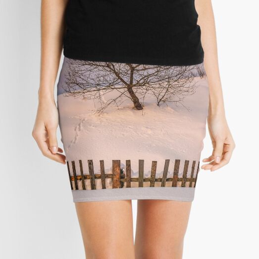 lonely tree on snowy hillside behind the fence Mini Skirt