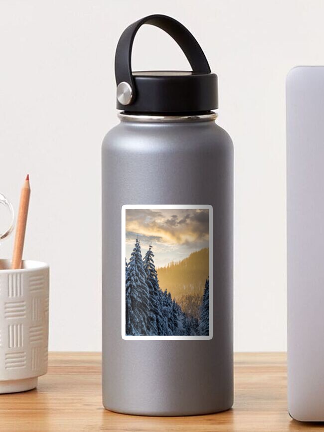 Thumbnail 1 of 3, Sticker, snowy spruce forest at gorgeous sunset designed and sold by mike-pellinni.