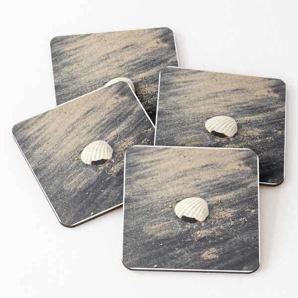 Item preview, White seashell on a black sandy beach designed and sold by mark-taylor.