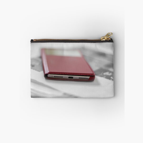 Item preview, Mobile phone in a red cover on a pile of papers designed and sold by EG Creativity Art.