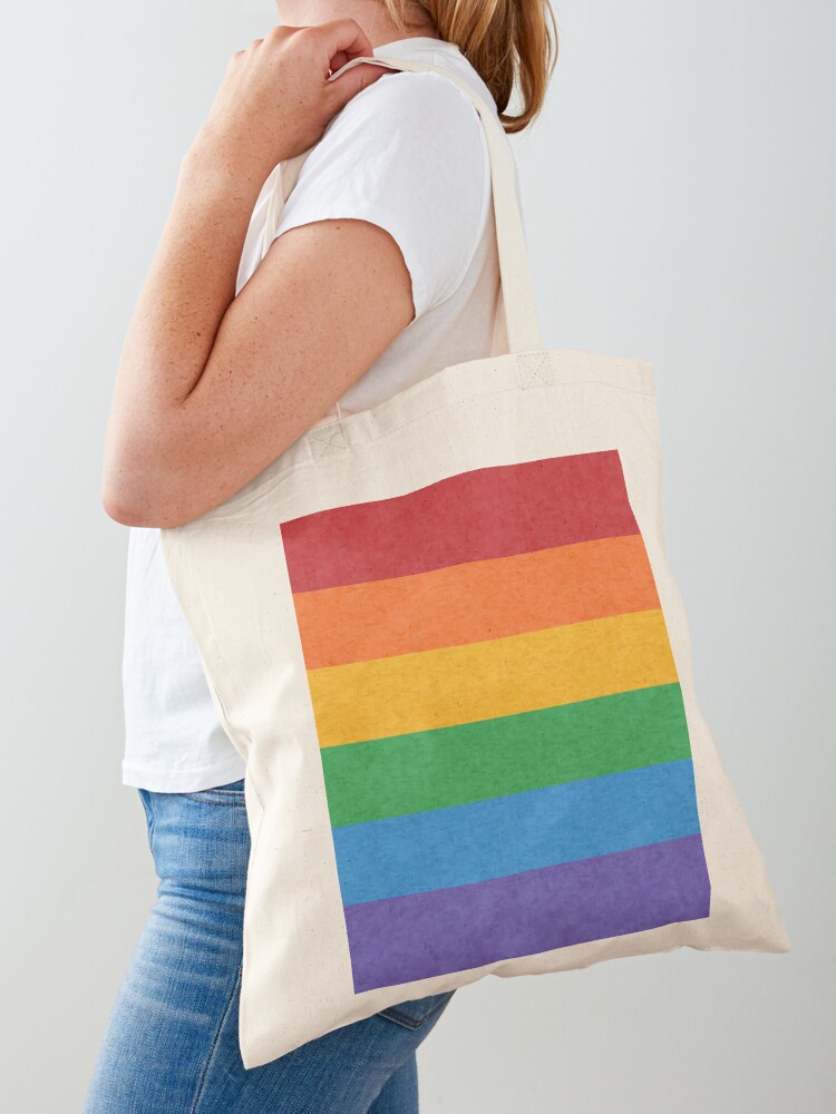 Premium Photo  Peace love pride text rainbow reusable bag against