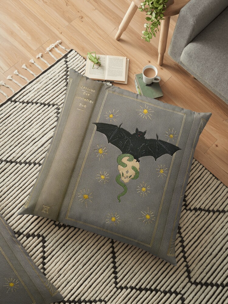 The Eerie Book Antique Cover With Bat Skull Spider Floor