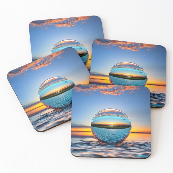 Item preview, Abstract art of a crystal sphere hovering above the ocean and reflecting the setting sun. Digital art designed and sold by Bookwyrm-Bazaar.
