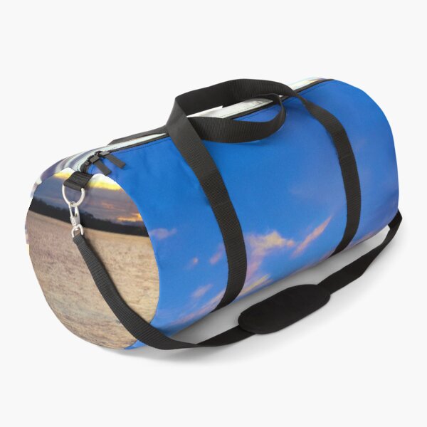 Item preview, Sunset of a beach. Blue waves in the water. designed and sold by Chris Purdy.