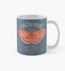 nocturnal orange moth running on coffee on dark background Mug
