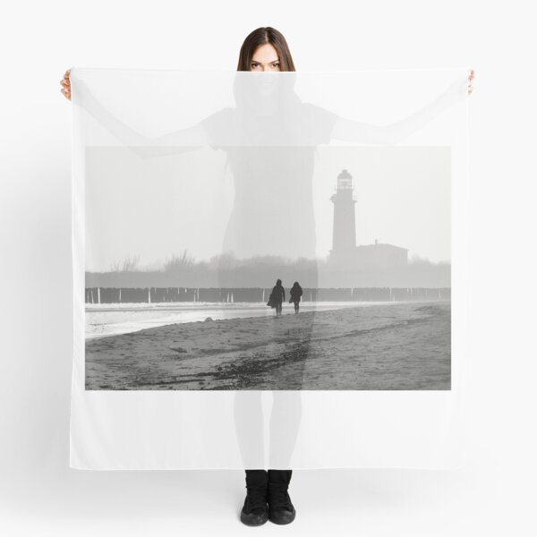 Romantic walking on the beach at the lighthouse Scarf