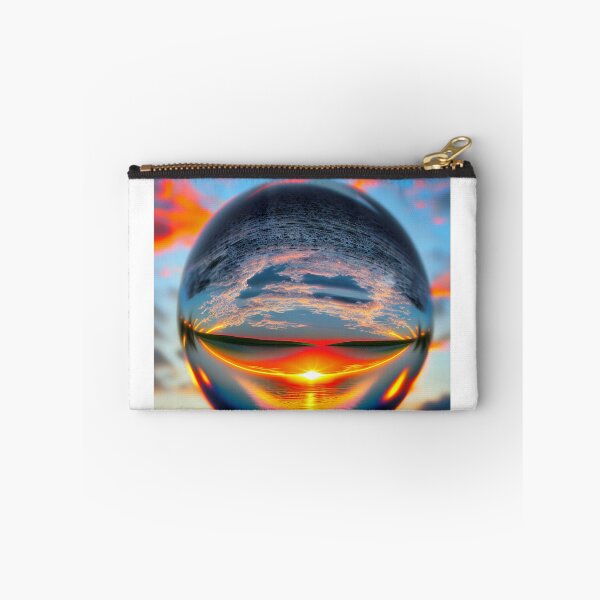 Item preview, Abstract art of a crystal sphere hovering above the ocean and reflecting the setting sun. Digital art designed and sold by Bookwyrm-Bazaar.