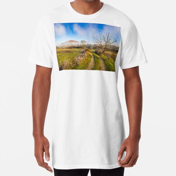 rural landscape with road through agricultural meadow in fog Long T-Shirt