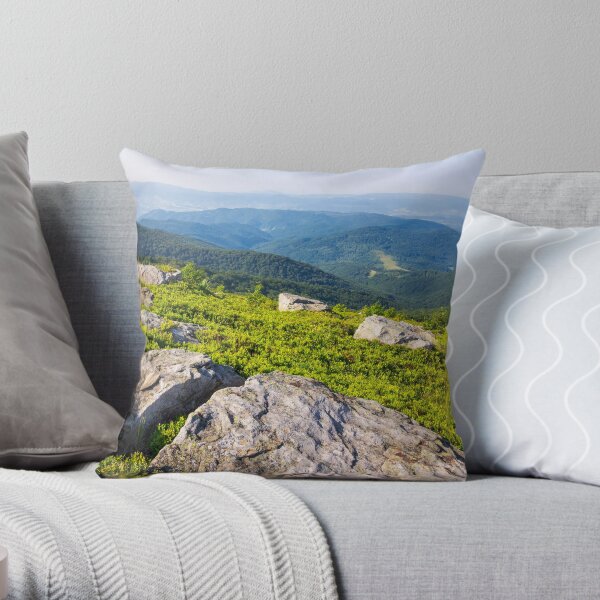 light on stone mountain slope Throw Pillow