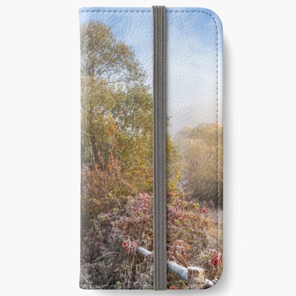 wooden fence in fog on frozen meadow at sunrize iPhone Wallet