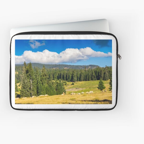 flock of sheep on the meadow near forest in mountains Laptop Sleeve