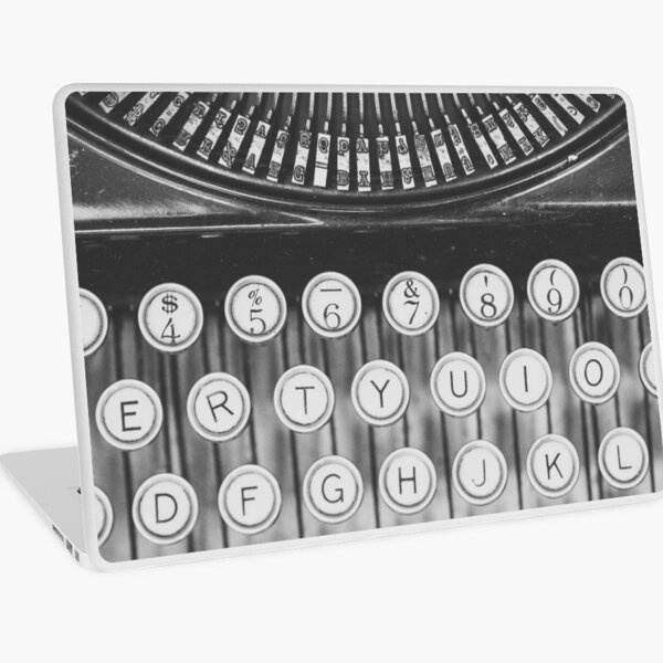 Fotografía de bodegón de una máquina de escribir vintage. Vinilo para portátil