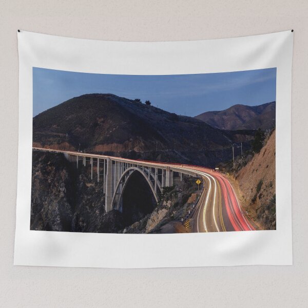 Item preview, Car light trails illuminating Bixby Creek Bridge designed and sold by yhelfman.