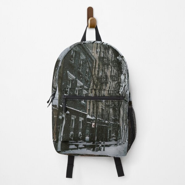Item preview, A person walking down the snow covered street surrounded by houses and trees in the city designed and sold by fowons.