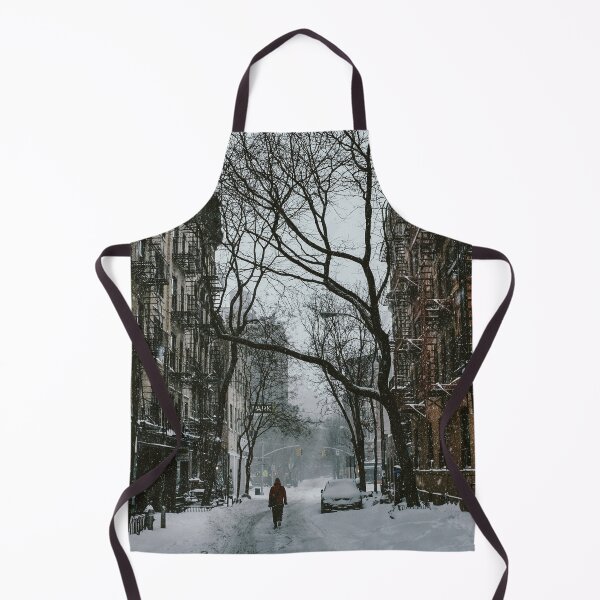 Item preview, A person walking down the snow covered street surrounded by houses and trees in the city designed and sold by fowons.