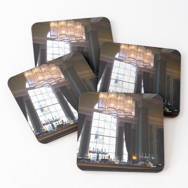 Item preview, Hotel bar interior with high ceiling, ornate hanging lights and tall window behind. designed and sold by claireseyeview.