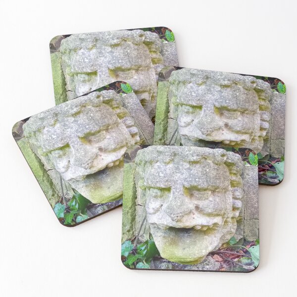 Item preview, Gargoyle stone head with open mouth on a stone wall with green leaves. designed and sold by claireseyeview.