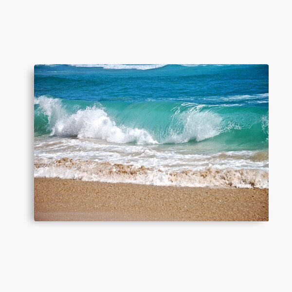 Wave breaking on the beach Canvas Print
