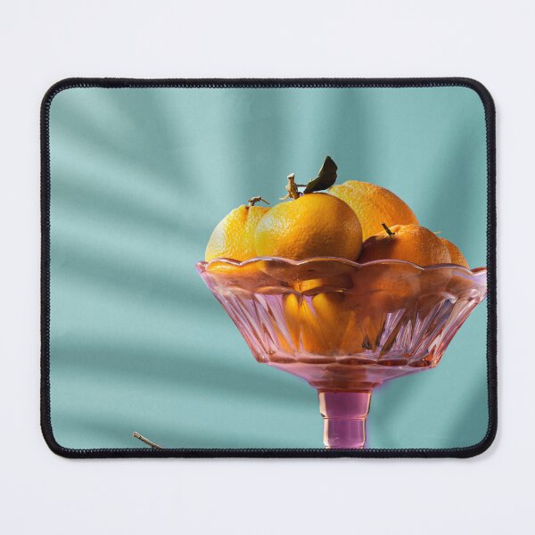 Item preview, Fresh ripe mandarine with autumn leaves falling in the air and some in stand plate with palm shadow designed and sold by sigoisette.
