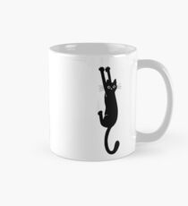 Black Cat Holding On Mug
