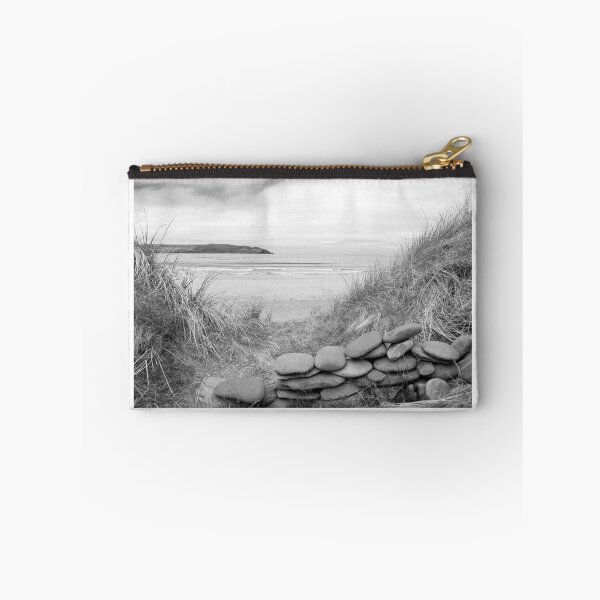 Item preview, stone wall shelter on a beautiful beach in black and white designed and sold by morrbyte.