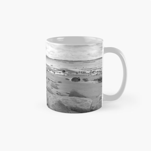 Item preview, stone wall shelter on a beautiful beach in black and white designed and sold by morrbyte.