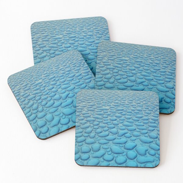 Item preview, Beads of water lying separately on a smooth blue surface. designed and sold by claireseyeview.