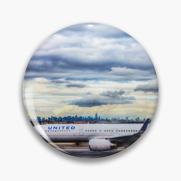 Item preview, United Airlines And Manhattan Skyline JFK Airport designed and sold by Paul Thompson Photography.