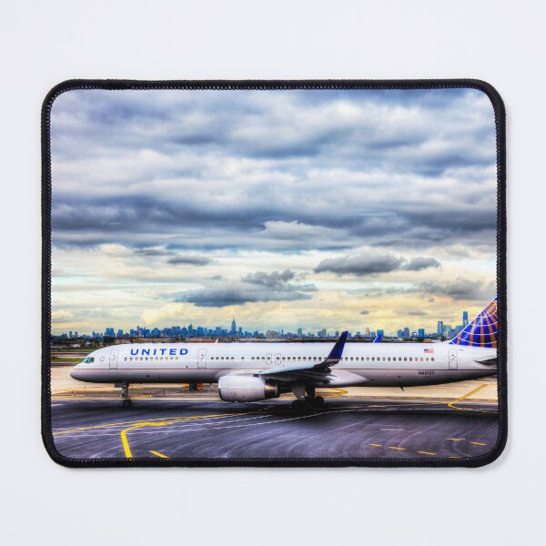 Item preview, United Airlines And Manhattan Skyline JFK Airport designed and sold by Paul Thompson Photography.