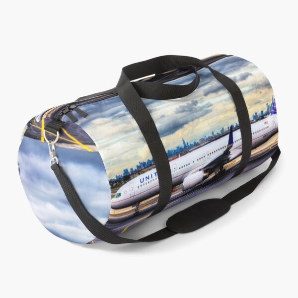 Item preview, United Airlines And Manhattan Skyline JFK Airport designed and sold by Paul Thompson Photography.