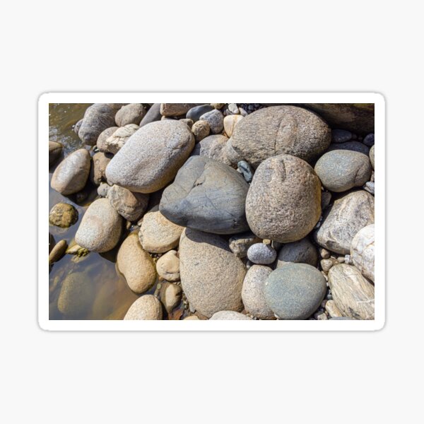 Sticker wet river stones background 