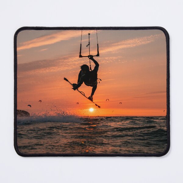Item preview, Kitesurfer silhouette in jump just above sunset designed and sold by Jens Breuer.