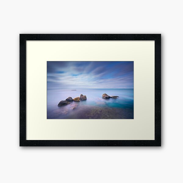 Rocks and sea, long exposure photograph Framed Art Print