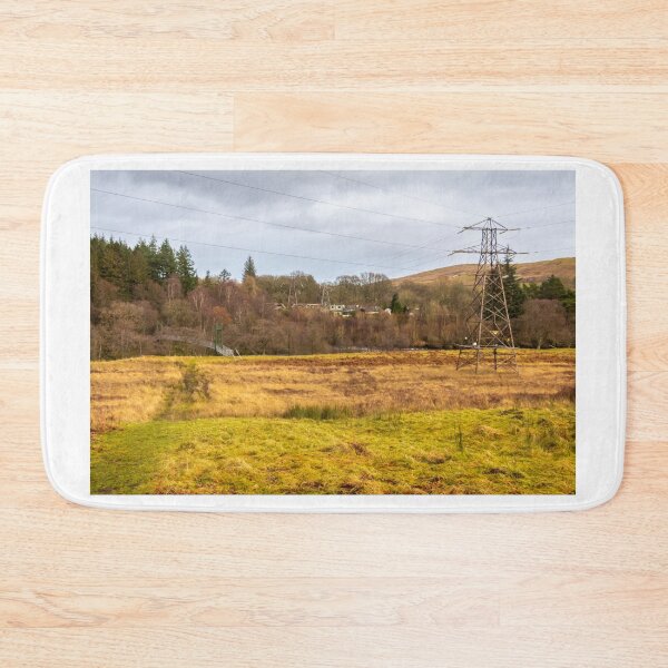 Item preview, Electricity pylons in a field on a cloudy day in winter at Kendoon Power Station, Galloway Hydro Electric Scheme, Scotland designed and sold by SnapTPhotograph.