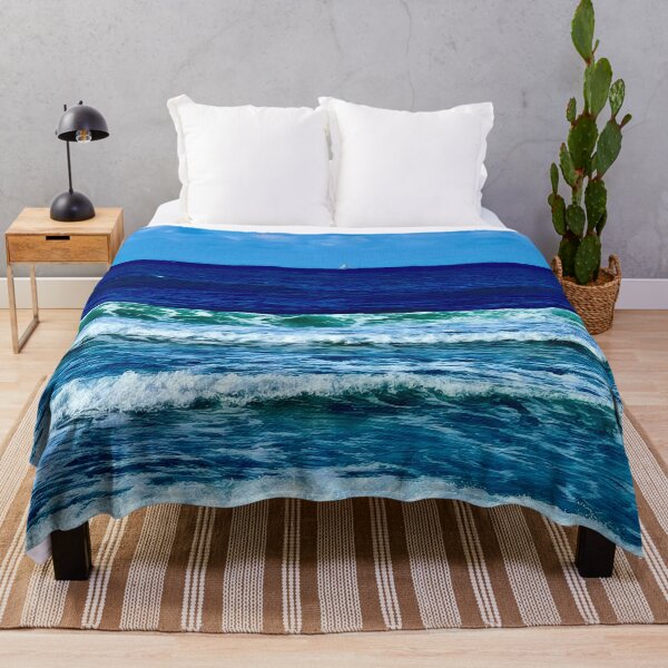 A Sailboat on the Deep Blue Sea Throw Blanket