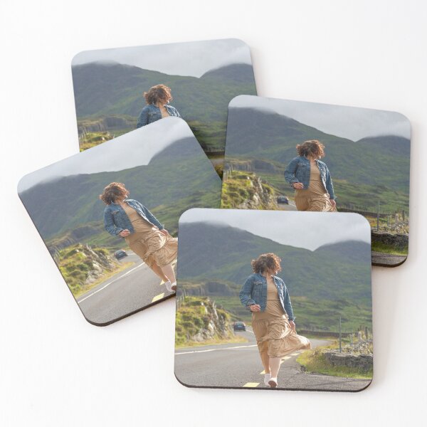 Item preview, A happy young woman wearing a dress and a blue denim jacket running along a road in Killarney National Park, Ring of Kerry, near the town of Killarney in County Kerry, Ireland. designed and sold by AlbertMi.